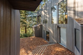 A center walkway separates the two structures. 