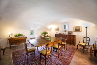 You Can Own Michelangelo’s Former Tuscan Villa For $9.3M - Photo 5 of 11 - The cool terracotta floors and white vaulted ceiling of the dining room can easily transition into a more minimalist modern space.