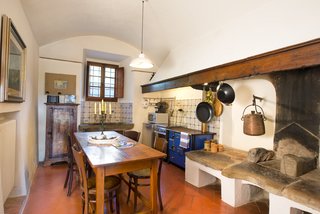You Can Own Michelangelo’s Former Tuscan Villa For $9.3M - Photo 9 of 11 - The kitchen features an original stone hearth and basin.