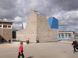 10 Buildings We Love by Piers Taylor - Photo 4 of 26 - Built out of raw concrete blocks, the building's interior is finished with bare plywood, OSB, and a varnished concrete screed. 