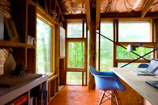 10 Buildings We Love by Piers Taylor - Photo 11 of 26 - Visible Studio is heated by waste wood from the woodland, and water from the roof feeds into an attenuation pond that forms a natural habitat. 