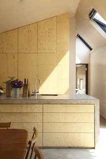 10 Buildings We Love by Piers Taylor - Photo 17 of 26 - The minimalist interiors are well-lit and showcase a simple material palette. 