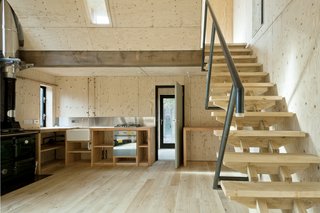 10 Buildings We Love by Piers Taylor - Photo 22 of 26 - The construction process was super-efficient; even the joinery was manufactured on site. The kitchen (which uses exposed copper piping for taps) has chunky timber worktops, and the stairs use an innovative, dry-jointed system that gains strength as the timber dries. The handrail is made of mild steel bent piping, which was also welded on site.