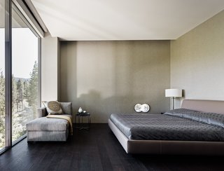 This Concrete Abode Stretches Over Giant Boulders - Photo 13 of 17 - One of the home's bedrooms. 