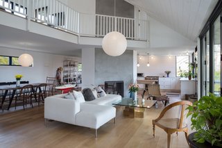 A Renovated Farmhouse in the Hamptons Hits the Market at $2.8M - Photo 4 of 13 - Interiors include an open floor plan, high ceilings, radiant heat, and hardwood floors throughout.