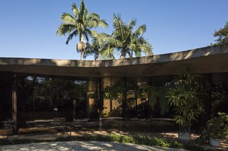 A Modern Concrete Retreat by Oscar Niemeyer Is Available For the First Time - Photo 2 of 6 - The roof is a low, flat, sinuous slab atop a long and slightly curved volume of rooms.