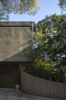 A Modern Concrete Retreat by Oscar Niemeyer Is Available For the First Time - Photo 4 of 6 - A hovering, monolithic concrete volume forms the bedroom wing and covers the carport. The rear of this volume is the only portion of the home that is visible from the street. 