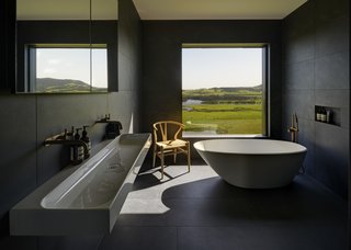 A simple soaking tub makes for a zen-like bath experience. 