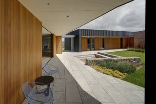 The living and dining areas open to the central courtyard, allowing easy indoor/outdoor access. 