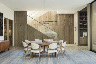 Rustic oak is also employed in the dining area, which sits off the living room. To the left is the 1,000-bottle dedicated wine cellar. 