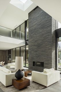 The space is anchored by the brick-inlay, indoor/outdoor fireplace.
