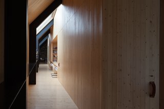 A Minimalist, Rick Joy–Designed Farmhouse in Vermont Asks $9.25M - Photo 7 of 12 - The interiors feature high-end finishings throughout. The basement of the main home even offers a synthetic ice floor for indoor hockey practice, which could also easily be retrofitted for additional living space and/or storage. 