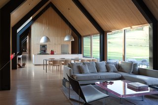 A Minimalist, Rick Joy–Designed Farmhouse in Vermont Asks $9.25M - Photo 4 of 12 - Ample glazing allows natural light to enter, while the minimalist pine interiors reflect a contemporary interpretation of the rural, northeast vernacular tradition. 