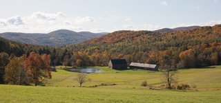A Minimalist, Rick Joy–Designed Farmhouse in Vermont Asks $9.25M - Photo 12 of 12 - Naturally integrated into its bucolic setting, the home overlooks a large, spring-fed swimming pond, rolling pastures, and the northern hardwood forests that make up the property. 