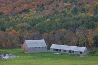 A Minimalist, Rick Joy–Designed Farmhouse in Vermont Asks $9.25M - Photo 11 of 12 - The detached barn offers garage and storage space, guest accommodations, studio space, an indoor/outdoor basketball court, and a 65-foot deck that cantilevers out over the pond. 