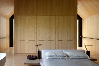 A Minimalist, Rick Joy–Designed Farmhouse in Vermont Asks $9.25M - Photo 9 of 12 - Clad in locally-sourced pine, the bedroom has a Shaker-like, minimalist aesthetic.
