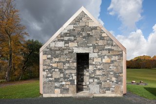 A Minimalist, Rick Joy–Designed Farmhouse in Vermont Asks $9.25M - Photo 1 of 12 - Vestigial stone walls remain scattered throughout the property, and are echoed in the home's poetic use of stone end walls.