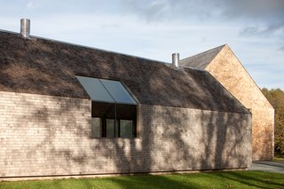 A Minimalist, Rick Joy–Designed Farmhouse in Vermont Asks $9.25M - Photo 3 of 12 - The design of the 3,890-square-foot main residence and its adjacent barn have been executed with the highest degree of craftsmanship and attention to detail, drawing from traditional influences and the vernacular of the rural northeast. 
