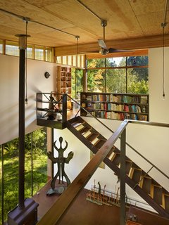 Reclaimed Materials Make Up This Artist Studio in Washington - Photo 3 of 6 - The double-height interior features a kitchen and living area on the ground level with a sleeping loft above. 
