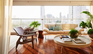 A wall of windows provides city views and ample natural light. 