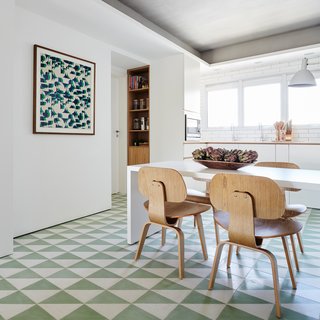 Colorful floor tiles add a whimsical touch to the eat-in kitchen area. 