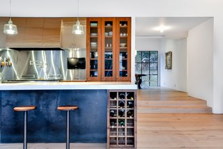 Own This Alluring Sculptural Abode in Austin For $3.1M - Photo 5 of 21 - While the kitchen features seating, a more formal dining area is only a few steps away. 