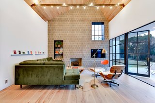 Own This Alluring Sculptural Abode in Austin For $3.1M - Photo 2 of 21 - The living space features plenty of natural light, and opens to the patio and pool area.