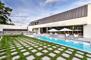 Own This Alluring Sculptural Abode in Austin For $3.1M - Photo 17 of 21 - The pool area is perfectly designed for outdoor entertaining. 