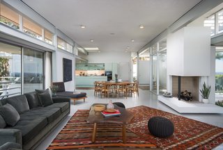 Rooney Mara Asks $3.45M For a Restored Midcentury Stunner in L.A. - Photo 4 of 8 - The kitchen features eggshell blue cabinetry and an island topped with stainless steel. 