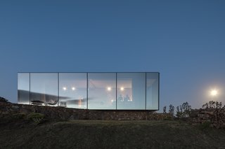 A New Prefab Hotel in Uruguay Seems to Melt Into the Landscape - Photo 9 of 9 - The prefab cabin is an arresting sight at night. 
