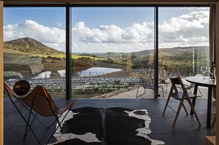 A New Prefab Hotel in Uruguay Seems to Melt Into the Landscape - Photo 5 of 9 - The wall of windows provides a stunning, panoramic view of the local landscape.