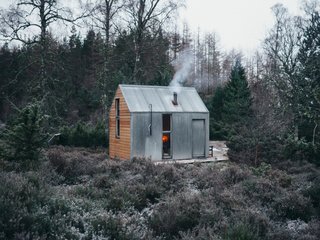 Go Off-Grid in This Prefabricated Cor-Ten Steel Cabin - Photo 1 of 12 - The Inshriach Bothy sits in a clearing in Cairngorms National Park in Northeast Scotland.