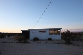 The couple wanted to be able to squeeze a full bathroom, kitchen, living room, storage, as well as a sleeping space that would accommodate a king-sized bed into the cabin's tiny layout.