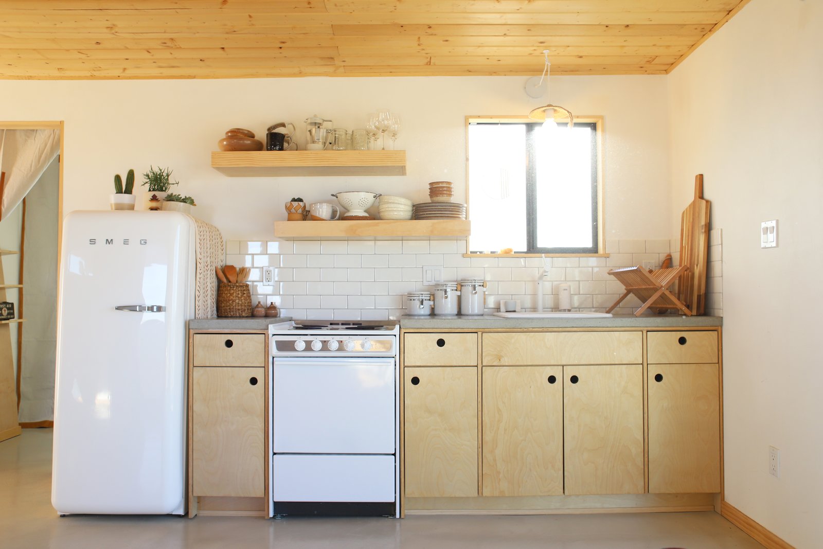 The petite open kitchen is....