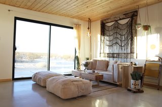 After: The sliding glass doors were added to help integrate the home to the outdoors. The abundant desert sunshine makes natural lighting a viable option all day long.