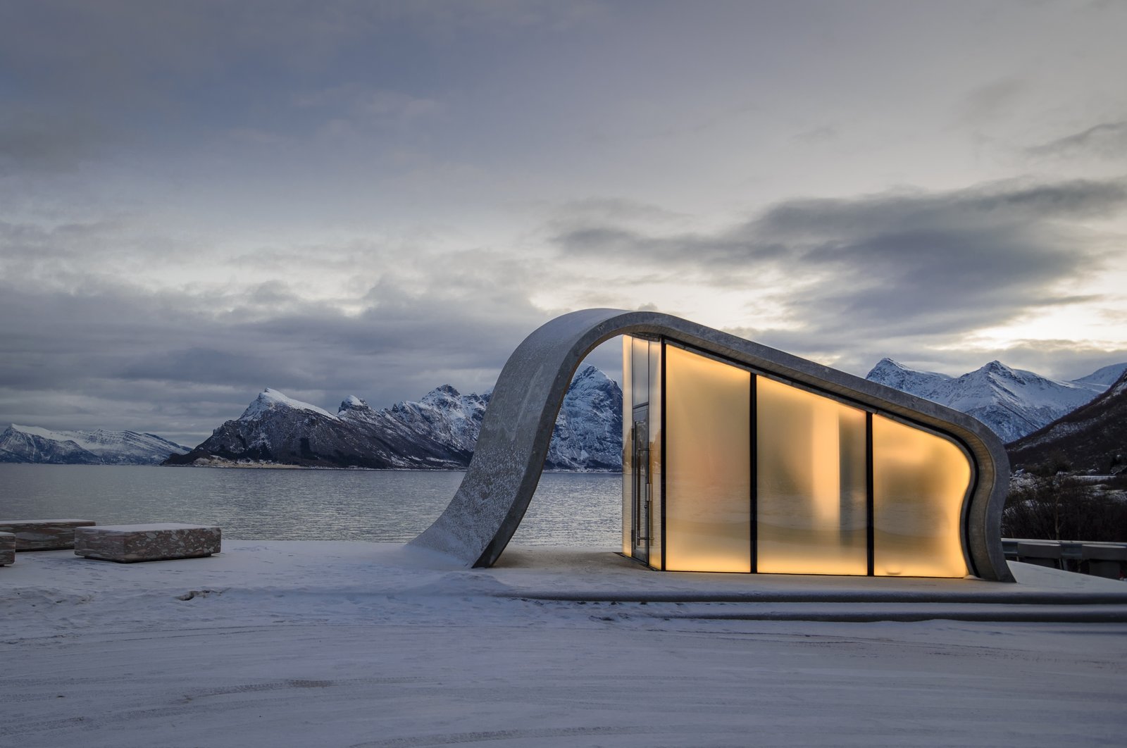 The smoothness of the poured concrete is strikingly juxtaposed against the rugged surrounding terrain.
