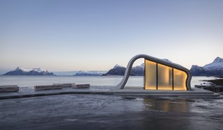 This Concrete Rest Stop Will Make You Want to Visit Norway - Photo 1 of 8 - The simple yet stunning structure that houses a public restroom features a concrete ceiling that emulates the shape of a wave forming from the surface of the terrace. 