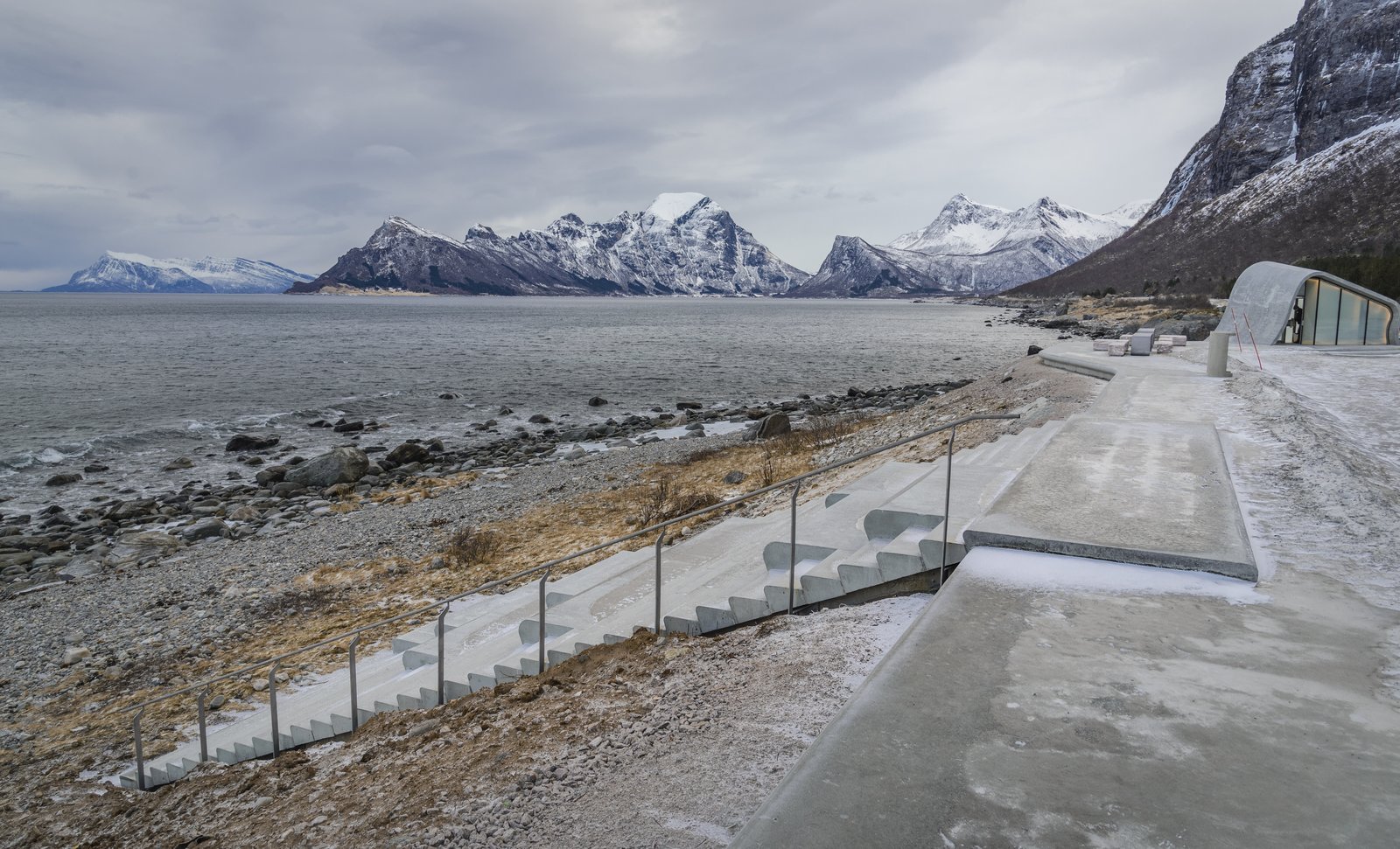 The amphitheater-style seating leads down to the beach area and provides stunning panoramic views of the fjord.