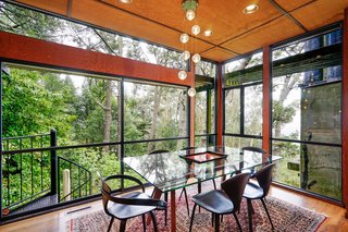 This Knockout Midcentury in the Bay Area Will Run You $1.9M - Photo 5 of 16 - The dining room is enclosed by glass, giving the sense of al fresco meals.