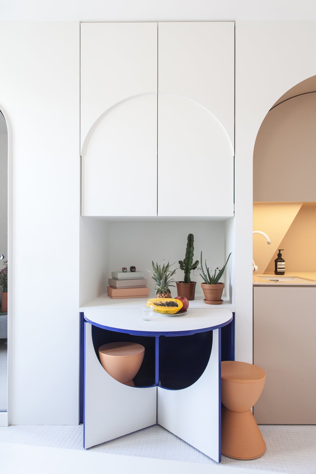 The small table with two stools pops out.