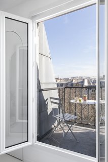 A small balcony reveals mesmerizing views of the city. 