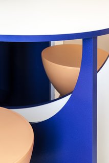 A detail of the brilliantly colored table and stools. 