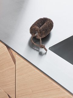 A geometric notch handle is placed in the corner, adding a graphic element to the design.