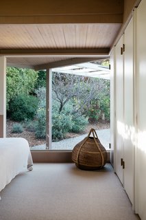 Even the lower-level bedroom features large windows overlooking the property. 