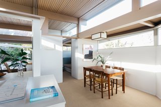 The open dining space is illuminated with natural lighting from virtually every angle. 