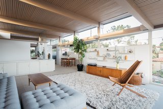 The spacious living room opens to the dining area, which sits off the kitchen. 