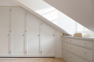 Custom millwork closets were added and lined with cedar and brass knobs that the owner found. Because of two dormers, the best use of space was to add drawers for additional storage. 