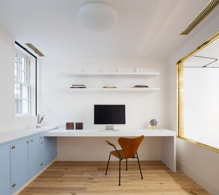 The cellar now houses an office, studio, and exhibition space. 