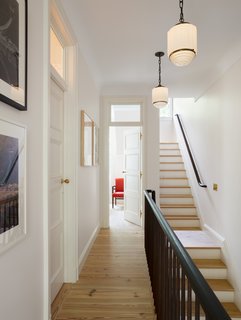 All of the doors in the hallway were salvaged and found by the owners. Yun designed and inserted the glass transom windows above the doors. 