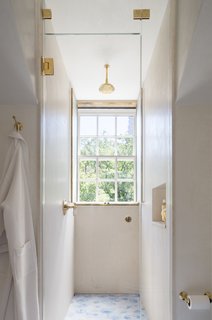 The shower is underneath a dormer, as it was the only way to fit in a shower and a tub. 